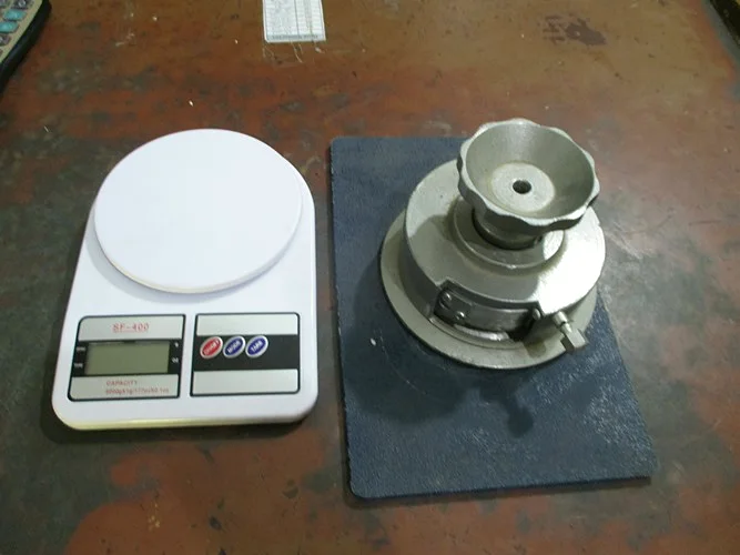 Quality control station at the SPORTIFY factory — garment weighing and testing equipment